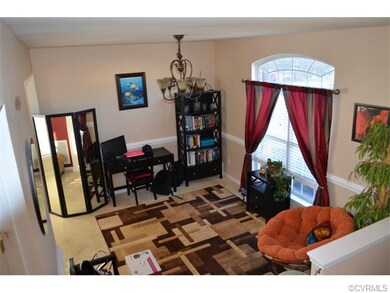 Spacious front room with lots of light and tall ce