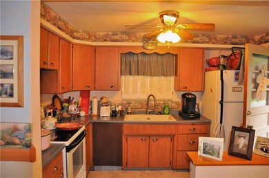CUTE KITCHEN WITH WOODEN CABINETS .