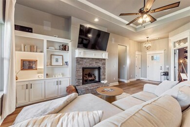 Living room with built in shelves, ornamental mold