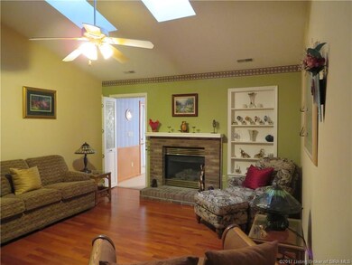 Living Room with Gas Burning Fireplace and Skyligh