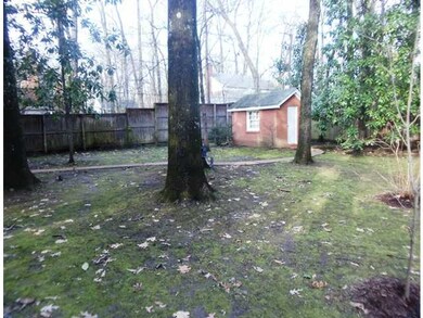 There is a brick house for storage or workshop on 