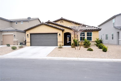 Mediterranean / spanish-style home with an attache