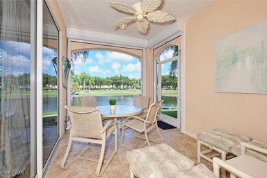 Sunroom / solarium featuring a water view and ceil