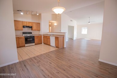 Dining to Kitchen to Great Room.