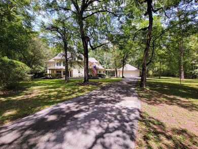 Country style home wrap around front porch on 3 acres.