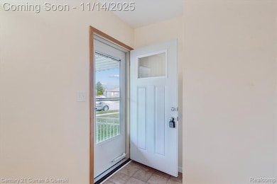 Doorway to outside with tile patterned floors