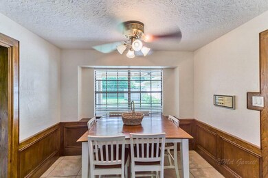 BREAKFAST AREA - is located adjacent to the kitchen, looks onto the backyard and measures 11x11.