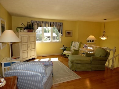 The 14X13 livingroom features lovely hardwood floo