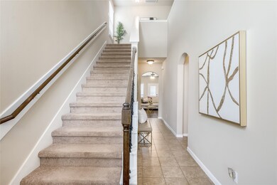 Elegant long hallway with a Spanish-style doorway
