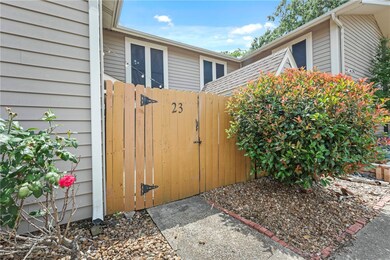 View of home's exterior featuring fence and a gate