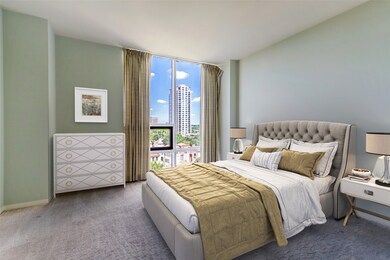 Primary bedroom with floor to ceiling window captu