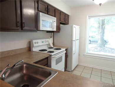 Kitchen with breakfast nook, tile floor and natura