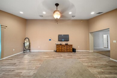 Unfurnished living room featuring light hardwood /