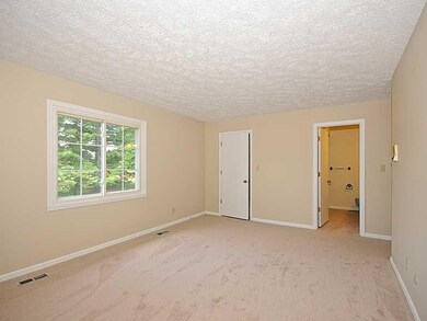 Master Bedroom. The master bedroom features two closets and an attached bath with dual vanities.