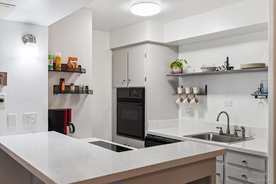Kitchen w/ quartz counters, new cooktop, breakfast bar seating!