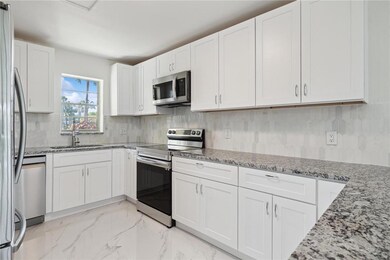BEAUTIFUL GRANITE COUNTERTOPS AND BRAND NEW STAINL