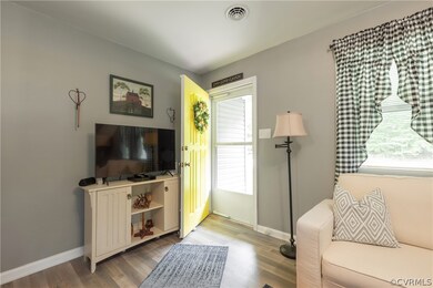 Living room with wood-type flooring