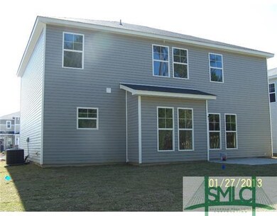 Exterior Back. Fully sodded yard with a 4 zone aut