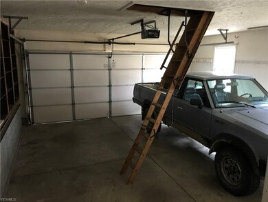 OVER SIZED 2 CAR SIDE LOAD GARAGE WITH PULL DOWN S