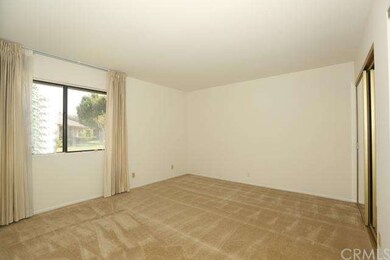 The bedroom is plenty big and has a view of the gr