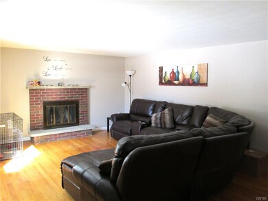 SPACIOUS LIVINGROOM WITH BRICK FIREPLACE....