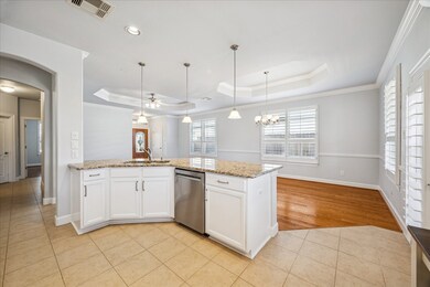 The can and pendant lighting give the home some charm.