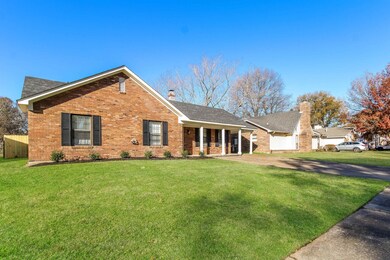 Ranch-style house featuring a front lawn