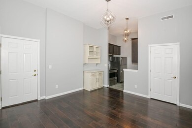 Living room and kitchen with a coat closet and add