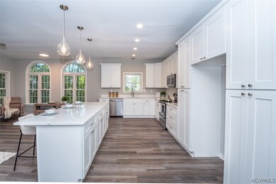 Kitchen with a center island, LVP flooring, new li