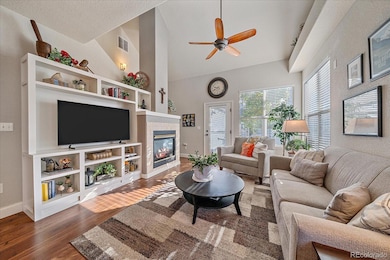 Family room with soaring ceilings and custom built in entertainment center