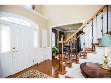 Two story foyer with dual coat closets