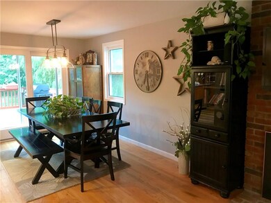 Dining area with slider out to large deck.