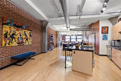Beautiful hardwood floors, exposed brick and open 