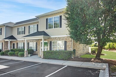View of front of property with uncovered parking a