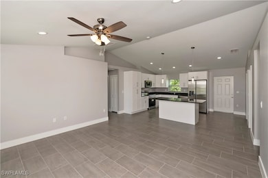 Kitchen featuring visible vents, white cabinets, o