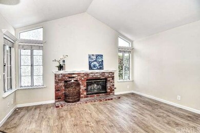 Great Living room with fireplace and lots of natur