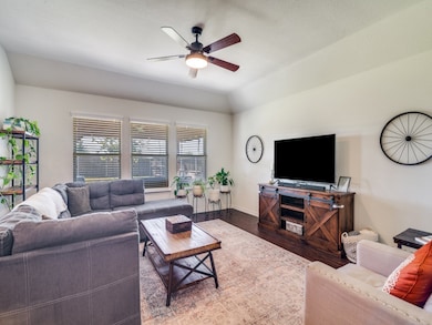 Strategically situated near the kitchen and dining area, the living area has great views of the back yard.