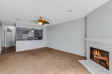 Unfurnished living room featuring light carpet, a 