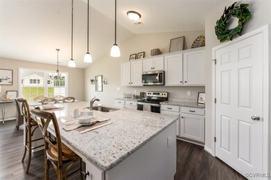 Kitchen featuring decorative light fixtures, white