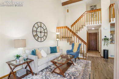 Living room with light hardwood / wood-style floor