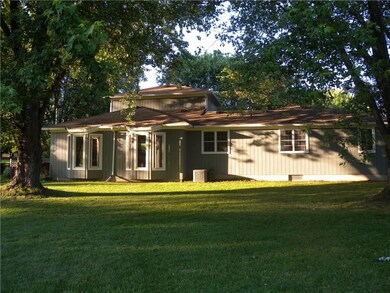 The mature shade trees help keep the home  cool in