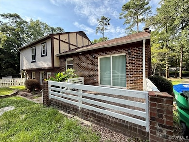 View of front of home with brick siding, stucco si