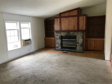 Large living room with fireplace and...