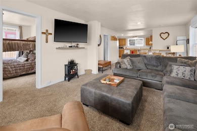 Another view of the living room and bedroom 2 off to the left