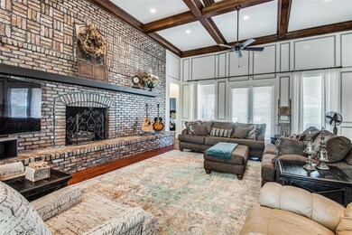 Stunning Great Room with Tall Ceilings, Wood Beams, Awesome Fireplace and Pool View!