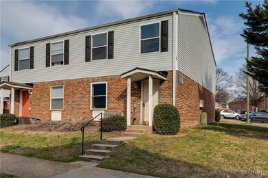 View of front facade with a front yard and brick s