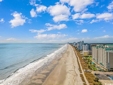 Water view featuring local beach and nearby urban area
