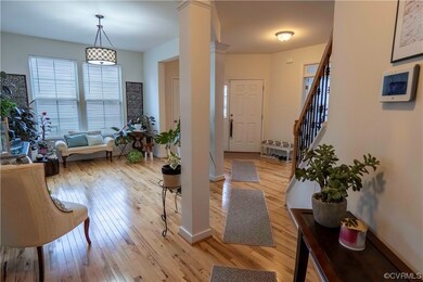 Foyer entrance with decorative columns and light h