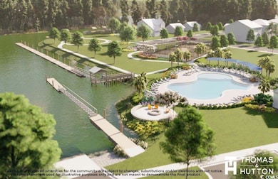 Aerial view of a nearby body of water and a pool