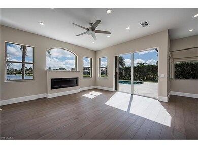 Family Room with Walls of Windows Overlooking Lake